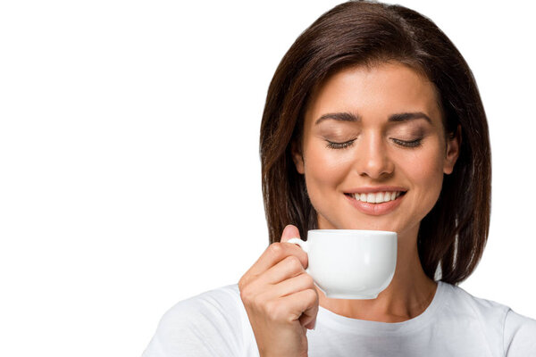 happy woman with closed eyes holding cup of coffee, isolated on white