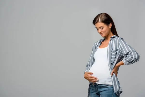 Happy Pregnant Woman Touching Belly Isolated Grey — ストック写真