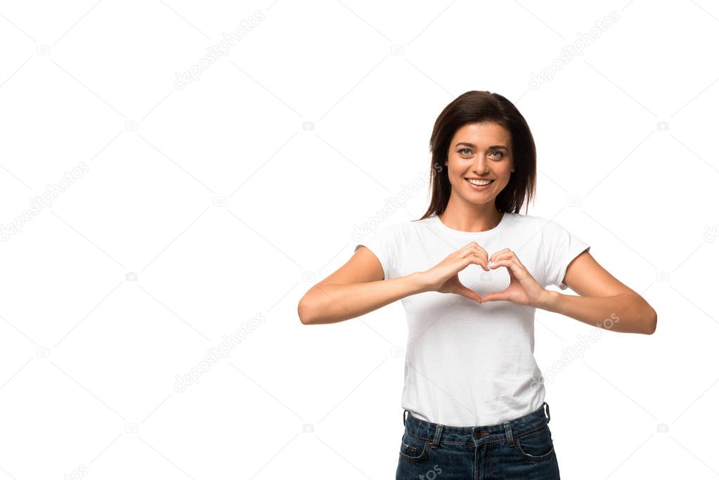 happy woman in white t-shirt showing heart sign, isolated on white