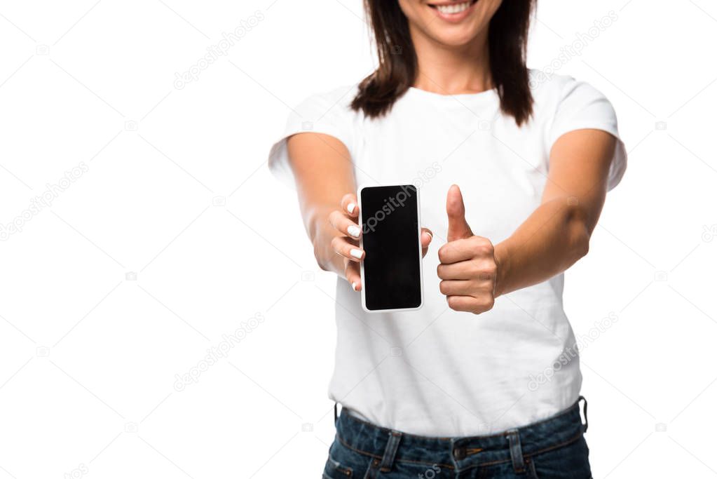 cropped view of woman showing thumb up and smartphone with blank screen, isolated on white