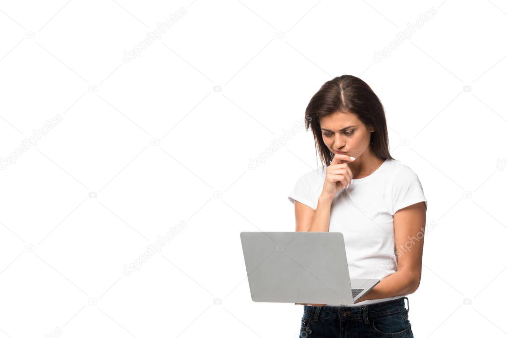 beautiful pensive woman using laptop, isolated on white