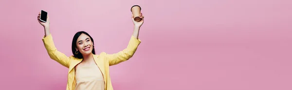 Happy Asian Woman Yellow Outfit Holding Smartphone Blank Screen Coffee — Stock Photo, Image