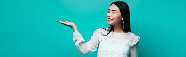 Happy Brunette Asian Woman Turquoise Background Panoramic Shot — Stock Photo, Image