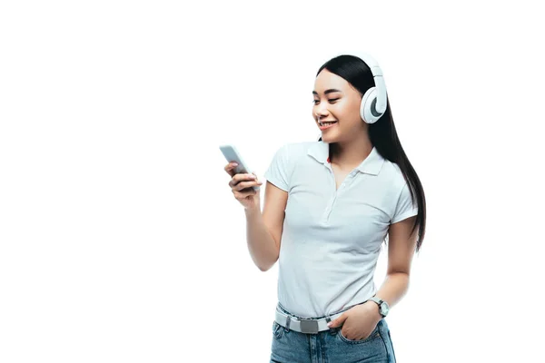 Smiling Attractive Asian Girl Headphones Using Smartphone Isolated White — Stock Photo, Image