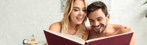 Excited Couple Reading Book Together Bed Morning — Stock Photo, Image