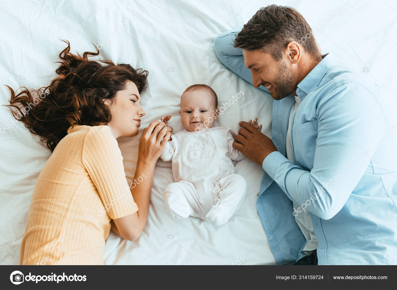 Happy Mom Dad Gently Touching Adorable Baby While Lying White Stock Photo By C Haydmitriy Happy Mom Dad Gently Touching Adorable Baby While Lying White Stock Photo By C Haydmitriy