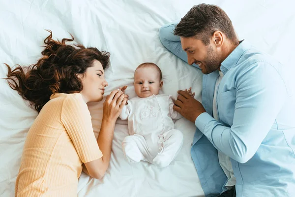 Happy Mom Dad Gently Touching Adorable Baby While Lying White — Stock Photo, Image