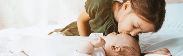 Panoramic Shot Adorable Child Kissing Little Sister Lying White Bedding — Stock Photo, Image