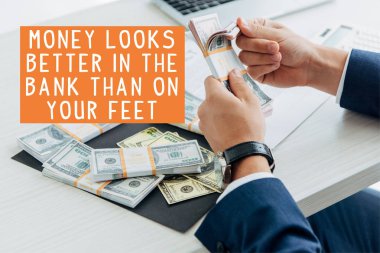cropped view of businessman counting money in office with money looks better in the bank than on your feet illustration clipart