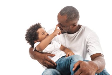 cheerful african american boy touching nose of happy father isolated on white clipart