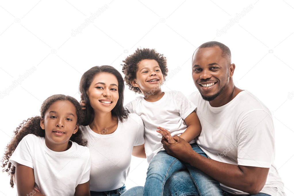 happy african american family smiling at camera isolated on white