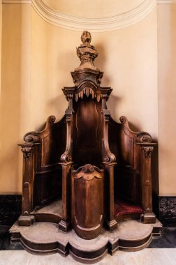 LVIV, UKRAINE - OCTOBER 23, 2019: wooden confessional in dominican church clipart