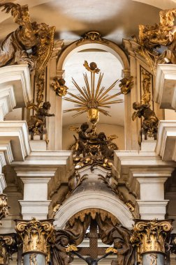 LVIV, UKRAINE - OCTOBER 23, 2019: low angle view of gilded statues of angels and archangels in dominican church