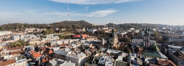 horizontal image of lviv cityscape with dominican church and carmelite church clipart