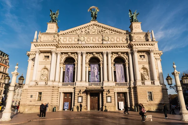 stock image LVIV, UKRAINE - OCTOBER 23, 2019: front view of Lviv Theatre of Opera and Ballet with people walking around