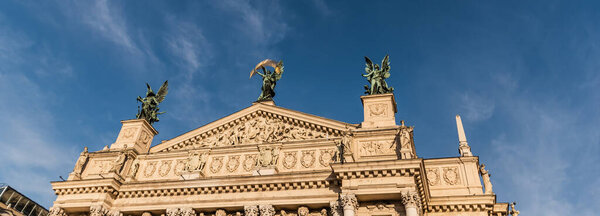 gable of Lviv Theatre of Opera and Ballet against blue sky, horizontal image