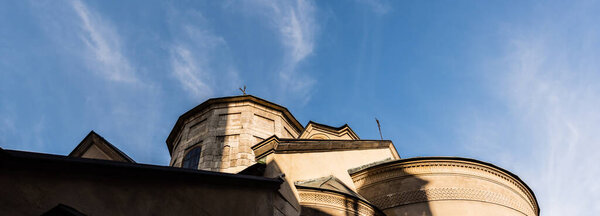 horizontal image of ancient church against blue sky in lviv, ukraine