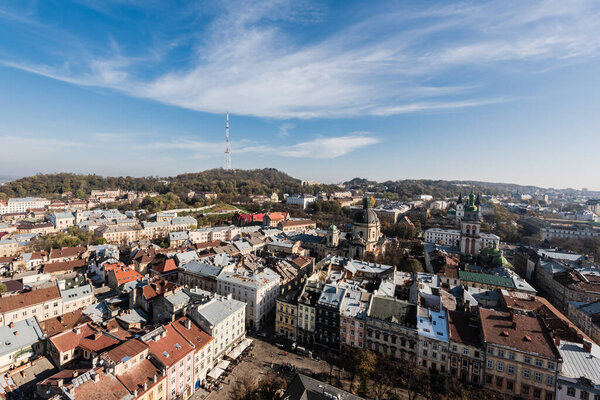 aerial view of cityscape with korniakt tower and latin cathedral in lviv, ukraine