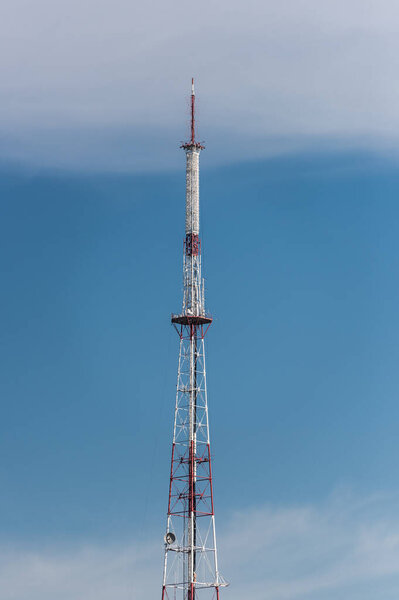 broadcasting tv tower against blue sky in lviv, ukraine