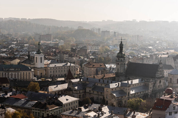 aerial view of city hall tower and dormition church in historical center of lviv, ukraine