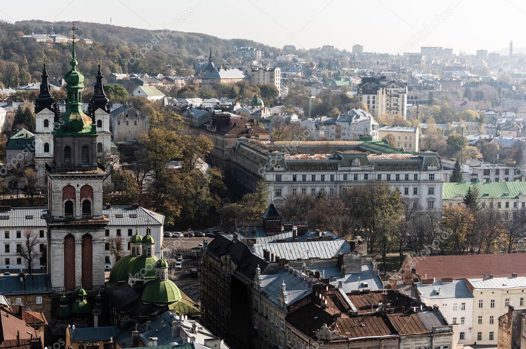 aerial view of lviv city with carmelite church and buildings in downtown of lviv, ukraine