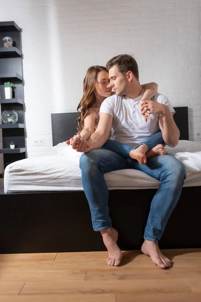 Young Woman Closed Eyes Hugging Handsome Boyfriend Sitting Bed — Stock Photo, Image