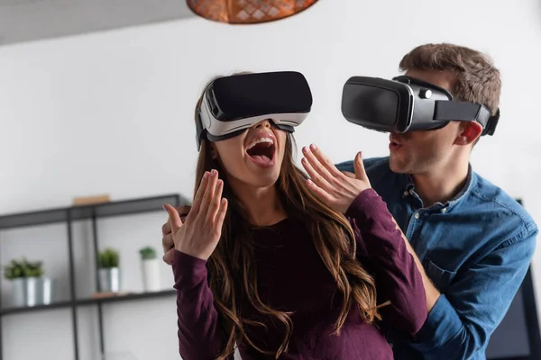Excited Girl Gesturing Man Virtual Reality Headset — Stock Photo, Image
