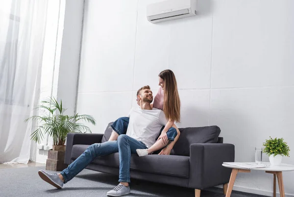 Happy Emotional Couple Hugging Home Air Conditioner — Stock Photo, Image