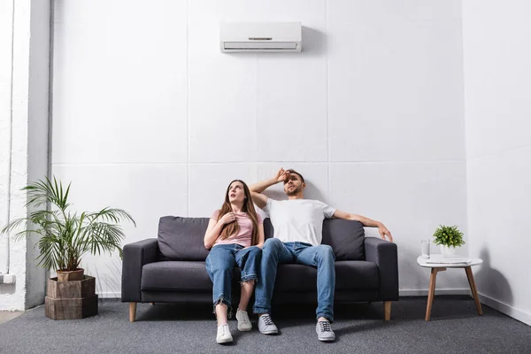 Young Sad Couple Suffering Heat While Sitting Home Broken Air — Stock Photo, Image