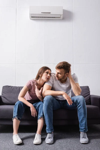 Young Couple Suffering Heat While Sitting Home Broken Air Conditioner — Stock Photo, Image