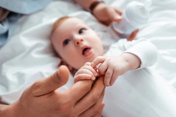 Selective Focus Cute Infant Touching Fathers Hands While Lying Bed — Stock Photo, Image