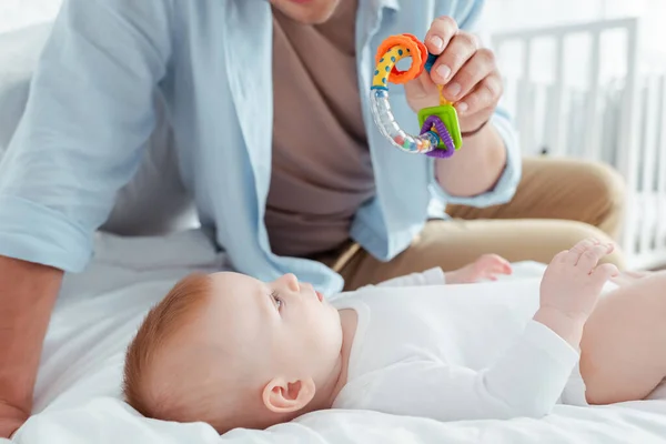 Cropped View Man Playing Baby Rattle Adorable Baby Boy — Stock Photo, Image