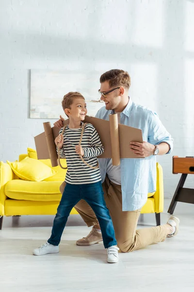 Smiling Father Fixing Carton Plane Wings Back Happy Son — Stock Photo, Image