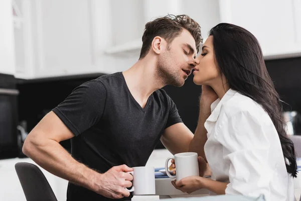 Handsome Man Kissing Beautiful Girlfriend While Drinking Coffee Kitchen — Stock Photo, Image