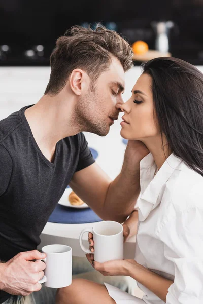 Handsome Man Kissing Beautiful Girlfriend Shirt While Holding Cup Coffee — Stock Photo, Image