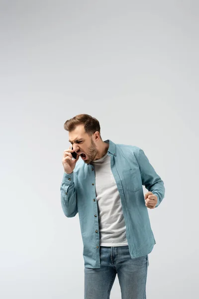 Angry Young Man Screaming Smartphone Isolated Grey — Stock Photo, Image