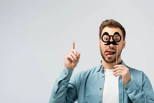 Funny Young Man Fake Mustache Glasses Stick Showing Tongue Pointing — Stock Photo, Image