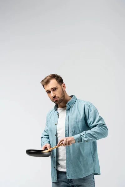 Sad Young Man Frying Pan Spatula Isolated Grey — Stock Photo, Image