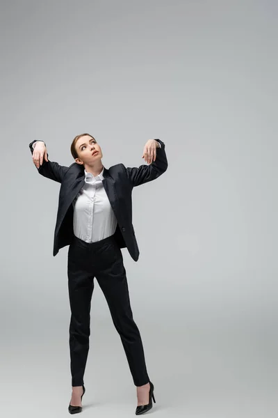 Mujer Negocios Marioneta Traje Posando Aislado Gris —  Fotos de Stock