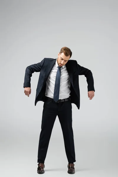 Businessman Marionette Suit Posing Hands Isolated Grey — Stock Photo, Image