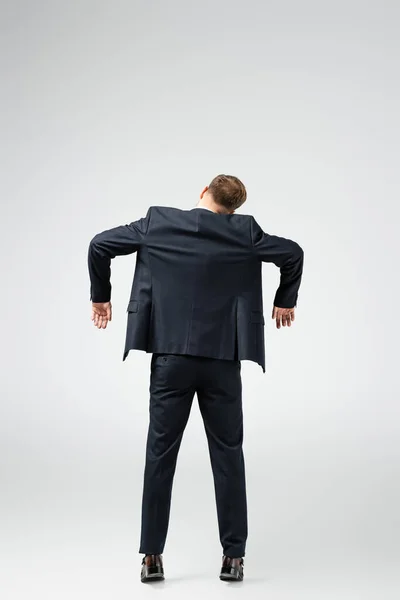 Back View Businessman Marionette Suit Posing Hands Isolated Grey — Stock Photo, Image