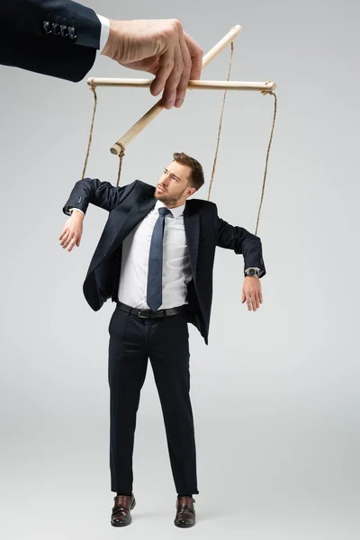Cropped View Puppeteer Holding Businessman Marionette Strings Isolated Grey — Stock Photo, Image