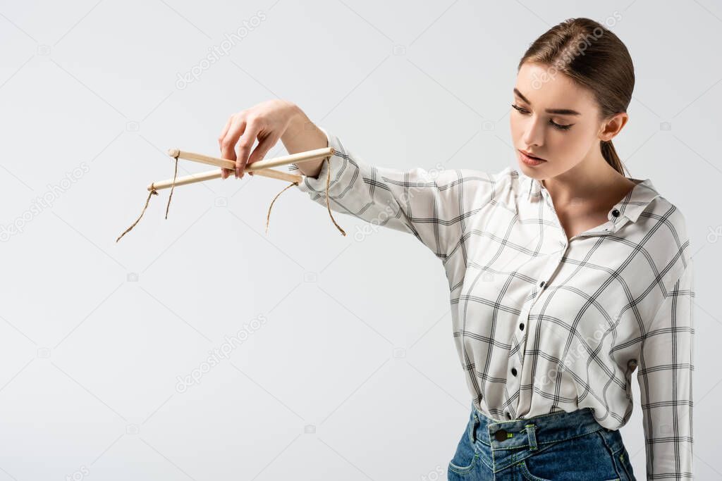 young attractive female puppeteer isolated on grey