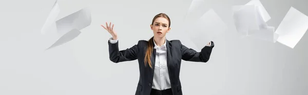 Displeased Businesswoman Suit Throwing Papers Air Isolated Grey Panoramic Shot — Stock Photo, Image