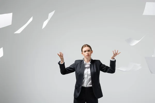 Displeased Businesswoman Suit Throwing Papers Air Isolated Grey — Stock Photo, Image
