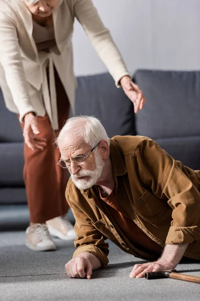 Cropped View Woman Helping Fallen Senior Husband Get Floor — Stock Photo, Image