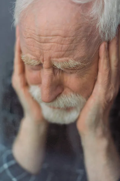 Selective Focus Senior Depressed Man Closed Eyes Touching Face Window — Stock Photo, Image