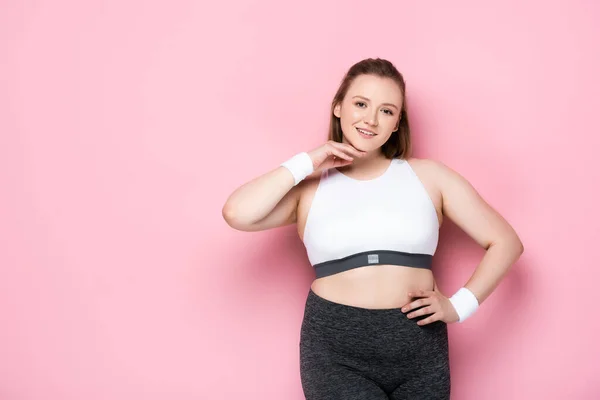 Beautiful Overweight Girl Touching Chin While Smiling Camera Pink — Stock Photo, Image