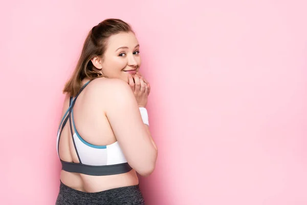 Cheerful Overweight Girl Touching Chin While Looking Camera Pink — Stock Photo, Image