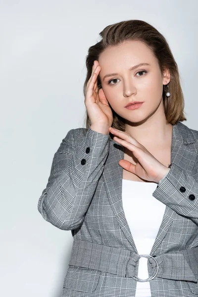 Attractive Confident Overweight Girl Touching Face While Posing Grey — Stock Photo, Image